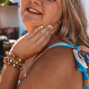 Woman in a blue bikini with a blurred outdoor background