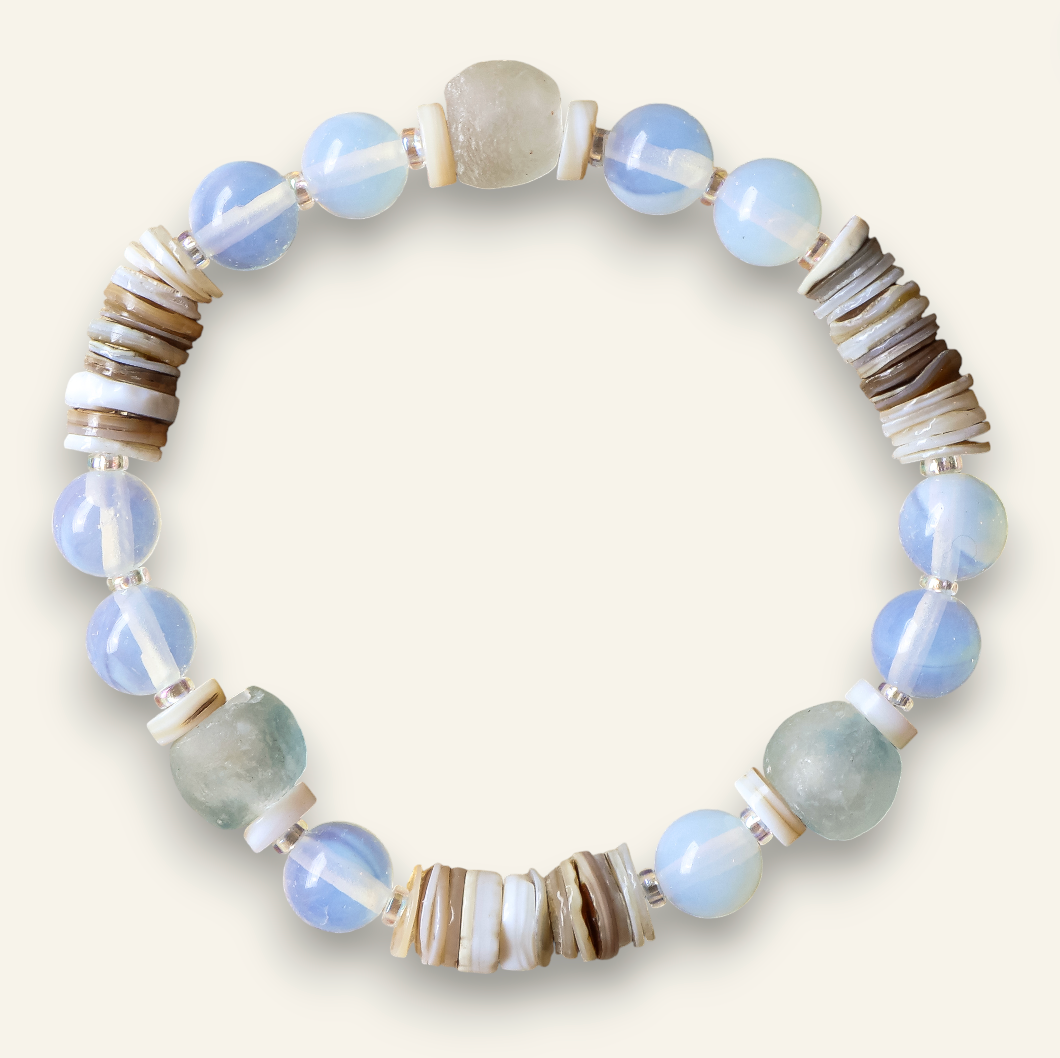 Beaded bracelet with blue, gray, and brown beads on a white background