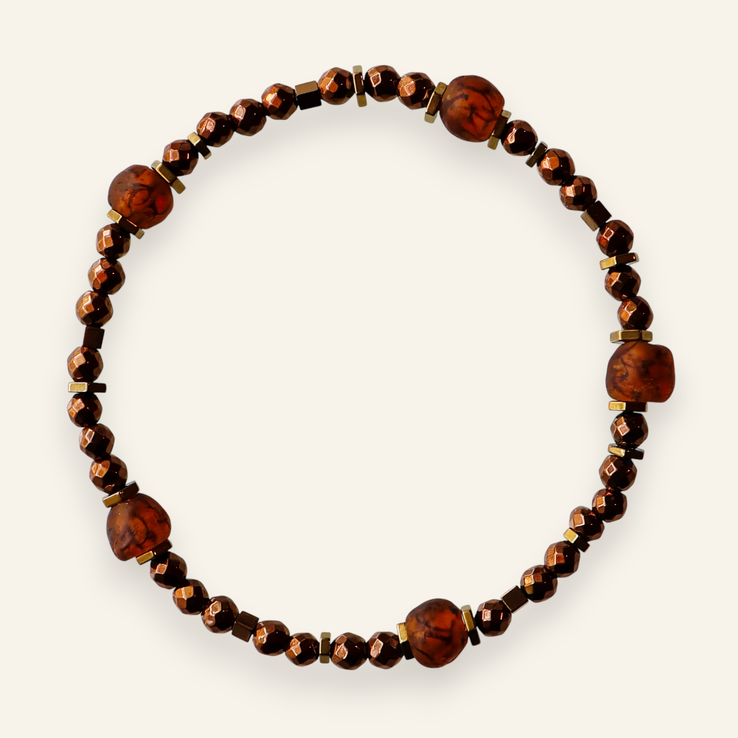 Bracelet with brown beads on a white background